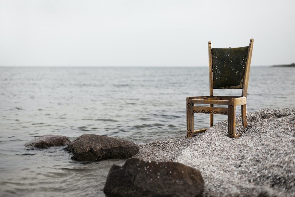 A wooden chair kept on sea shore